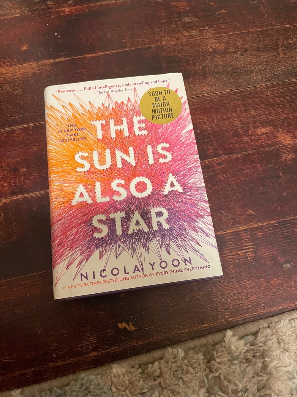 The Sun Is Also A Star by Nicola Yoon — White with Pink & Orange Cover